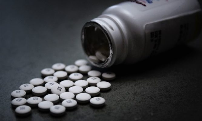 Opioids Spilling Out on a table. U.S. Airforce photo illustration by Technical Sgt. Mark R.W. Orders-Woempner