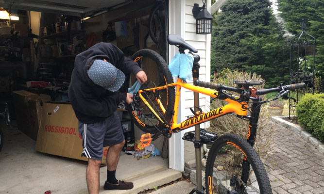 Sean Logan repairing a bike.
