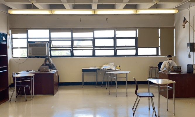 Two teachers socially distanced