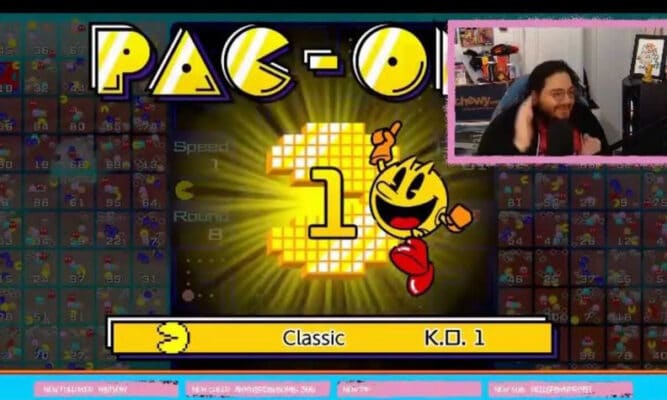 a screen of a video game that says Pac-One (I think - the "ne" at the end of "One" is covered up.) There's another small screen on the top right showing Brendan Reilly. this is his ti