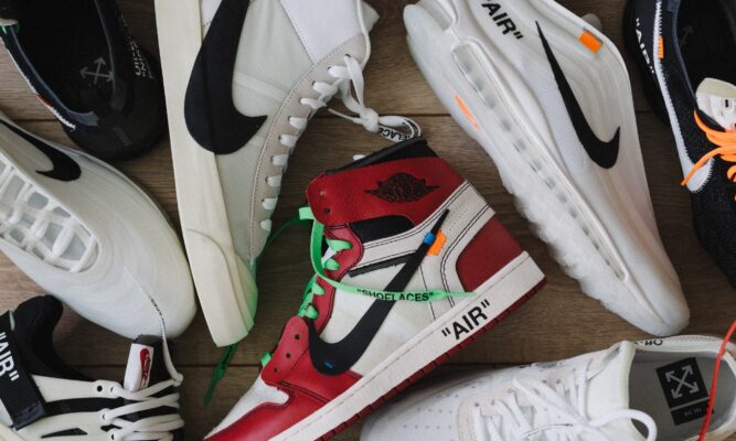 a photo of about six sneakers -mostly lying on their side - only one of each style. Most are Nikes.