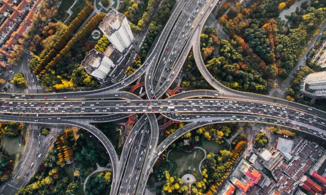 An aerial view looking down at a series of crossing highways.