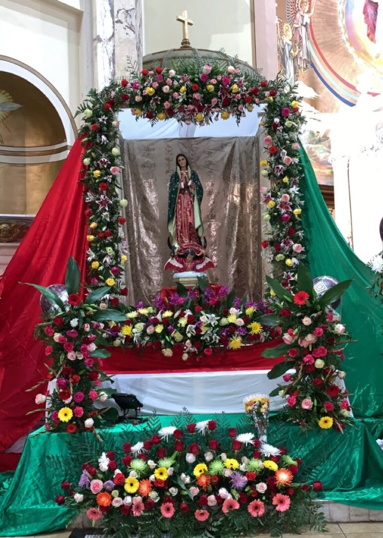 Alter for the Virgin of Guadalupe adorned with flowers.