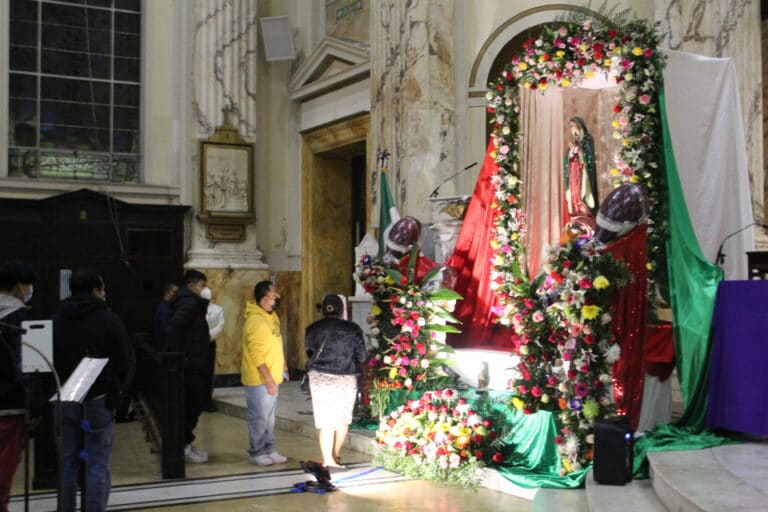 Parishioners lined up at the alter of the Virgin of Guadalupe.