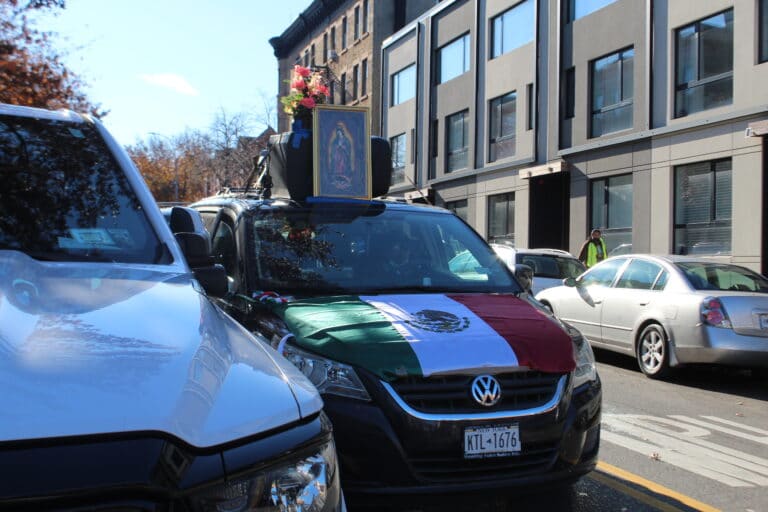 Van decorated with a Mexican flag and portrait of the Virgin of Guadalupe.