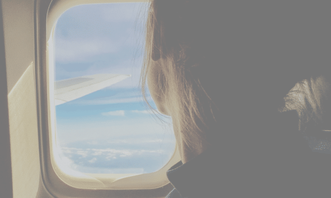 Looking out a airplane window .Photo by Tim Gouw from Unsplash