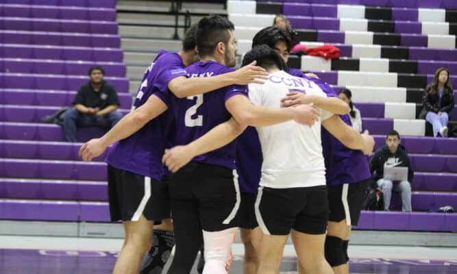 Men's Volleyball team huddles up