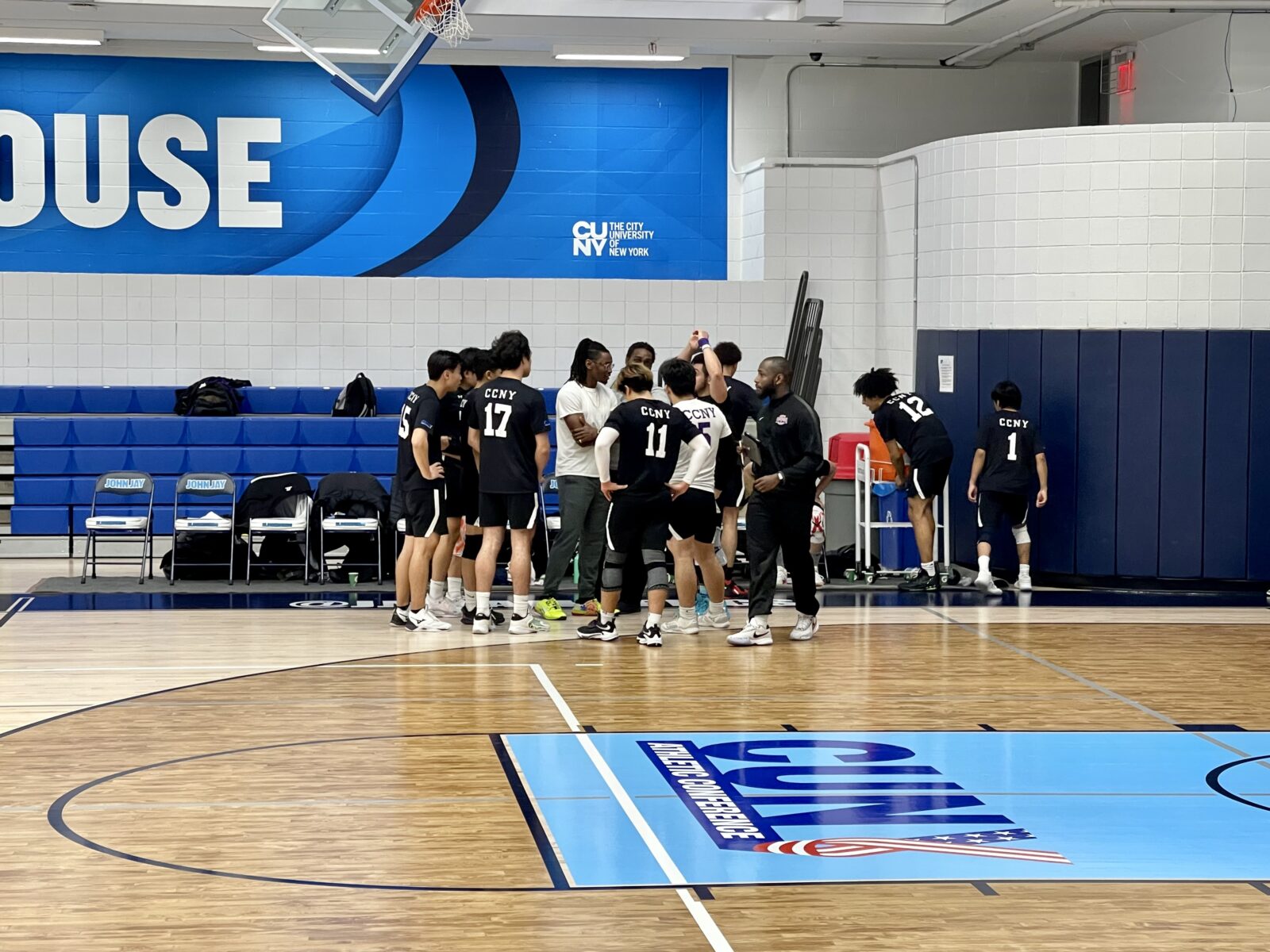 City college men's volleyball huddles in between sets