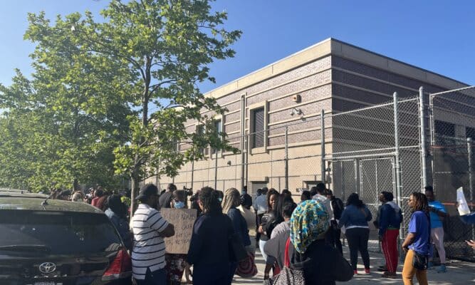 Parents of student at P.S.189 gather in front of the standalone gym.