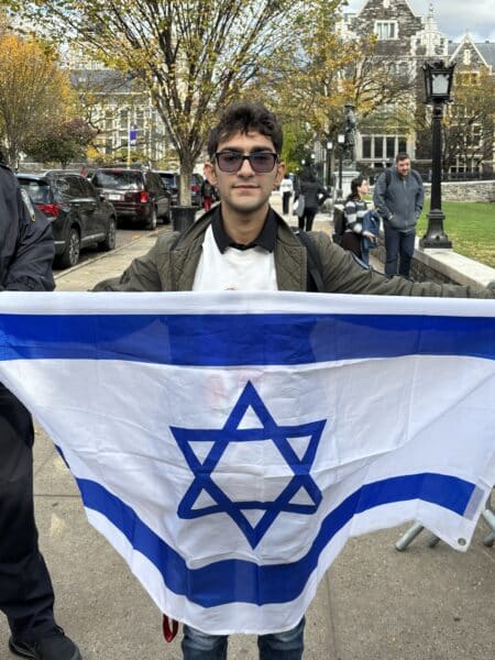 Nathaniel Borukhov City College Student with the Israeli flag