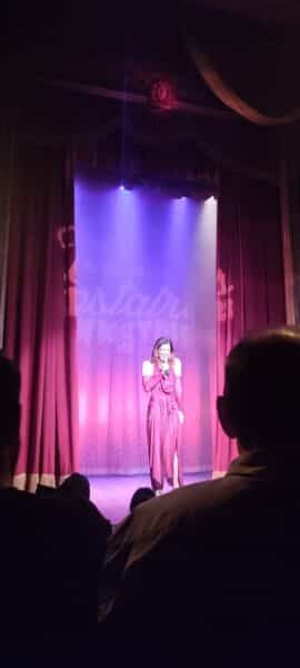A woman performer on stage at The Slipper Room. 