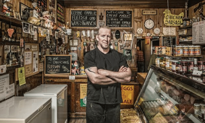 Man standing in the Empire Butcher Shop