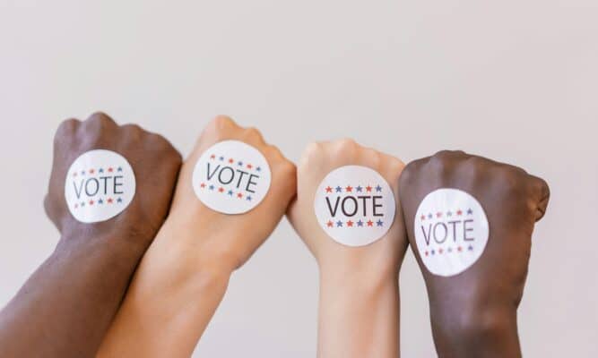 Vote Stickers on Hands