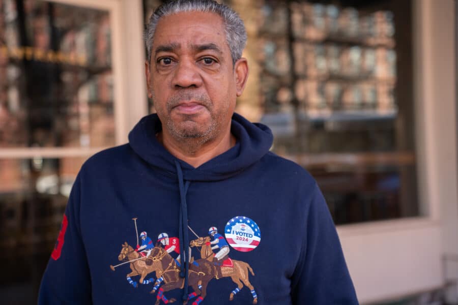 Man with I voted sticker and jockeys. Photo by Muhammed Irfan