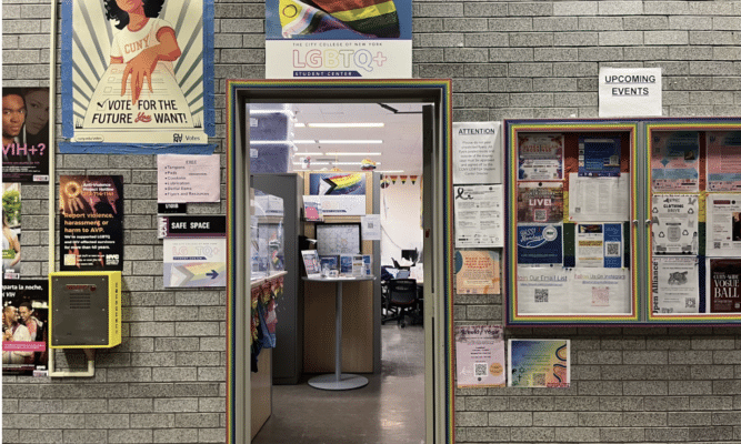 A doorway adorned with posters.