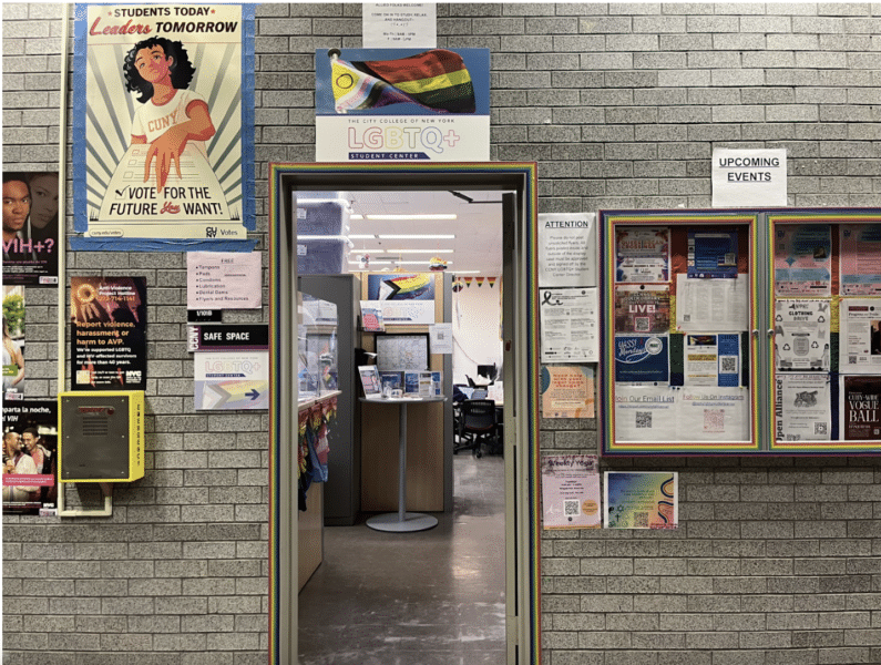 A doorway adorned with posters.