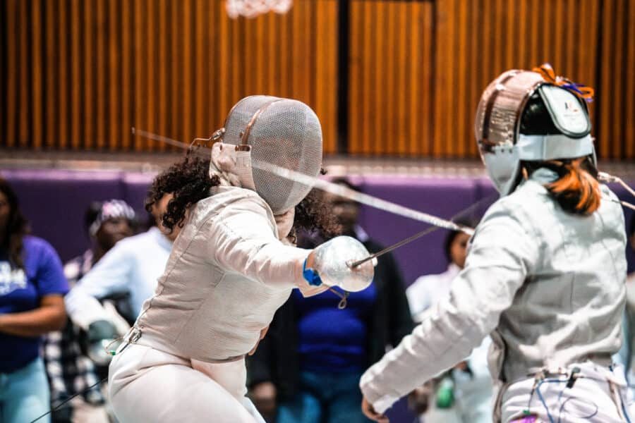 Close-up of two women fencing