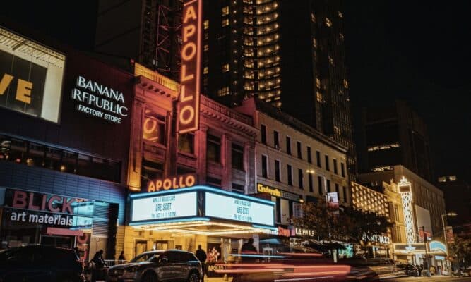 A picture on 125th street of the Apollo Theater, next to a Banana Republic and a Blick art materials.