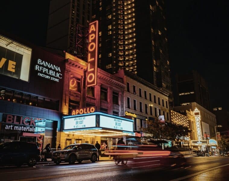 A picture on 125th street of the Apollo Theater, next to a Banana Republic and a Blick art materials.