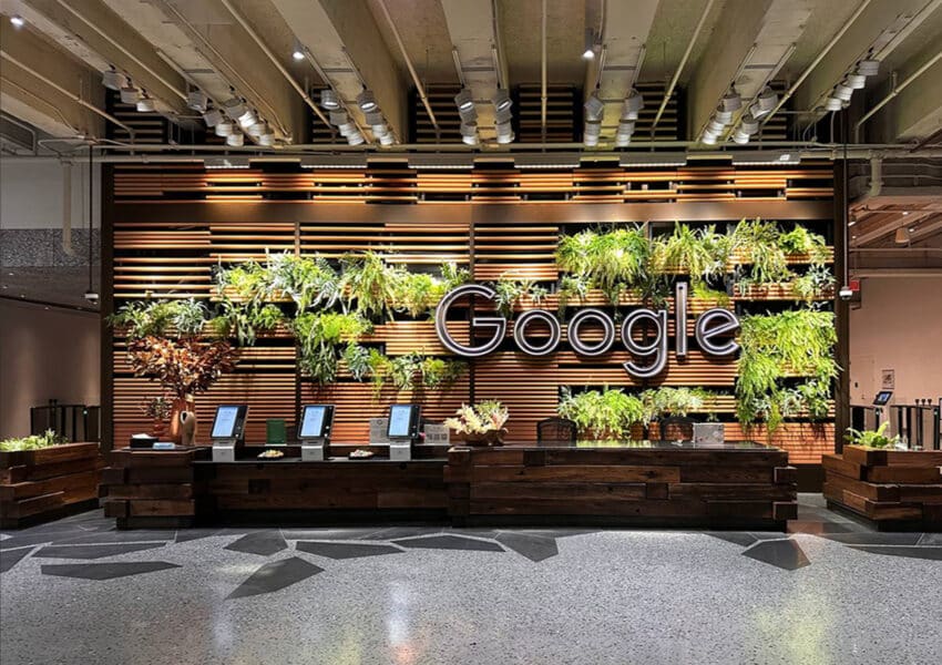 A photo of the Google’s newest headquarters with the use of bioliphic architecture, greenery integrated in the walls of the main wall of the main building entrance.
