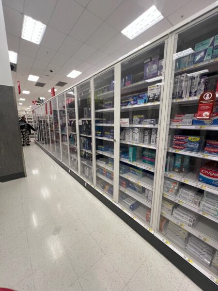 An aisle in Target that is completely locked up with theft preventing doors.