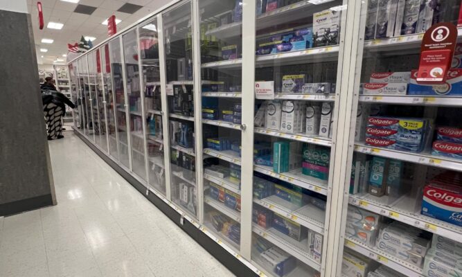 An aisle in Target that is completely locked up with theft preventing doors.