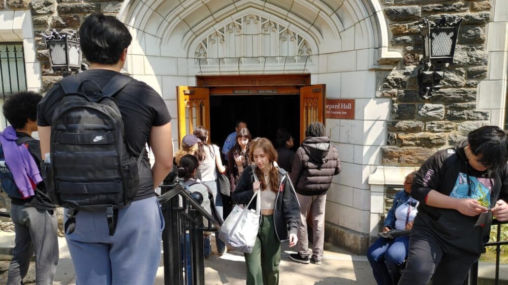 Students turned away from Shepard Hall.