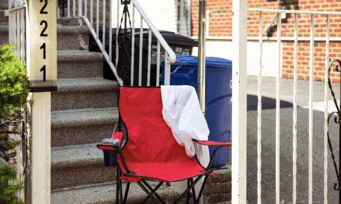empty chair and sandals in from of a stoop