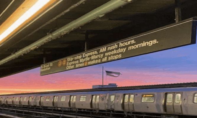 J-Train at Woodhaven Blvd. subway station. Photo by Elizabeth Marquez