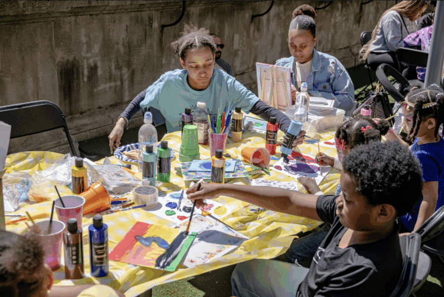 Teenagers painting in an after school program