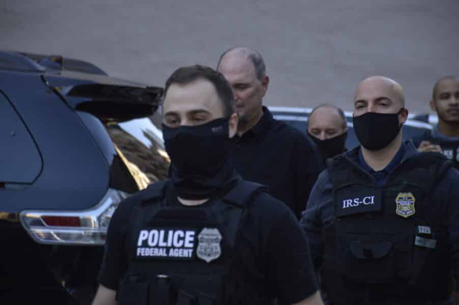 A group of masked federal agents