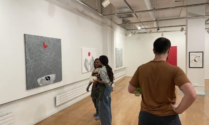 Students and peers examined the gallery