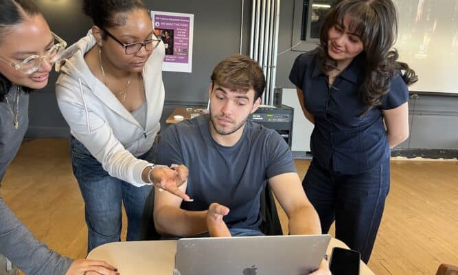 Students arounda computer