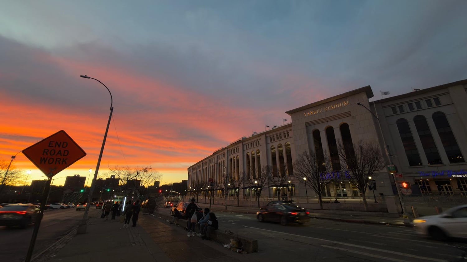 Yankee Stadium at sunset people waiting for a bus. Photo by Katherine Diaz Sanchez