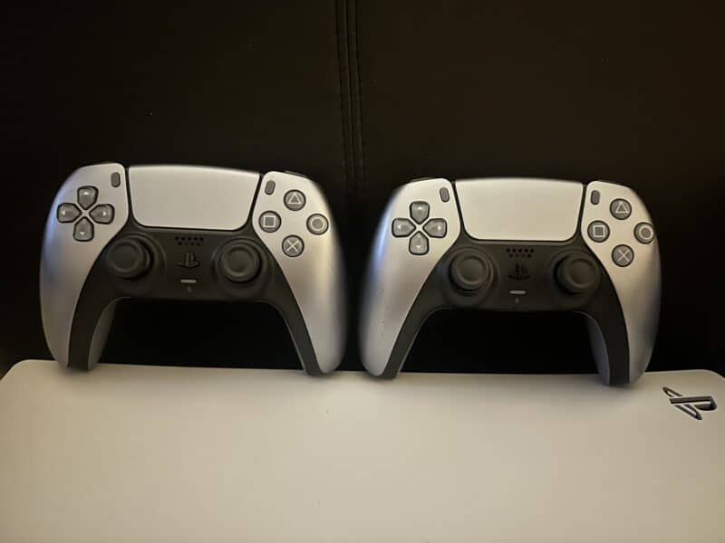 Two game controllers side-by-side.