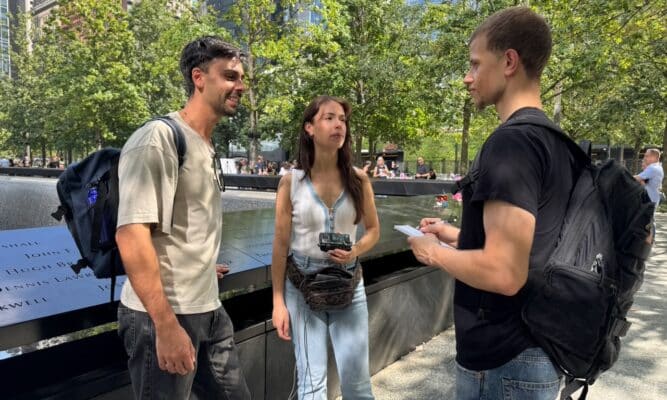 9/11 Memorial reporter with two tourists