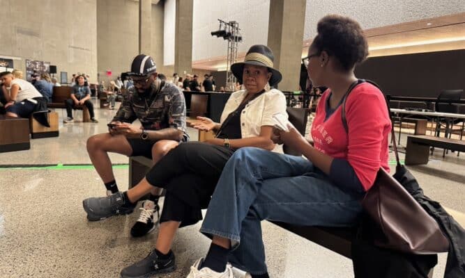 Zeinab Bah interviewing Vernice Gamble. Photo by Harlem View.