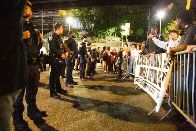 NYPD stands across from protesters during an I.C.E protest.
