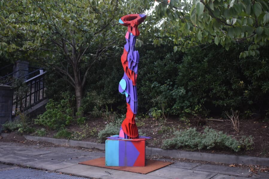 Vibrant red, purple, and turquoise sculpture